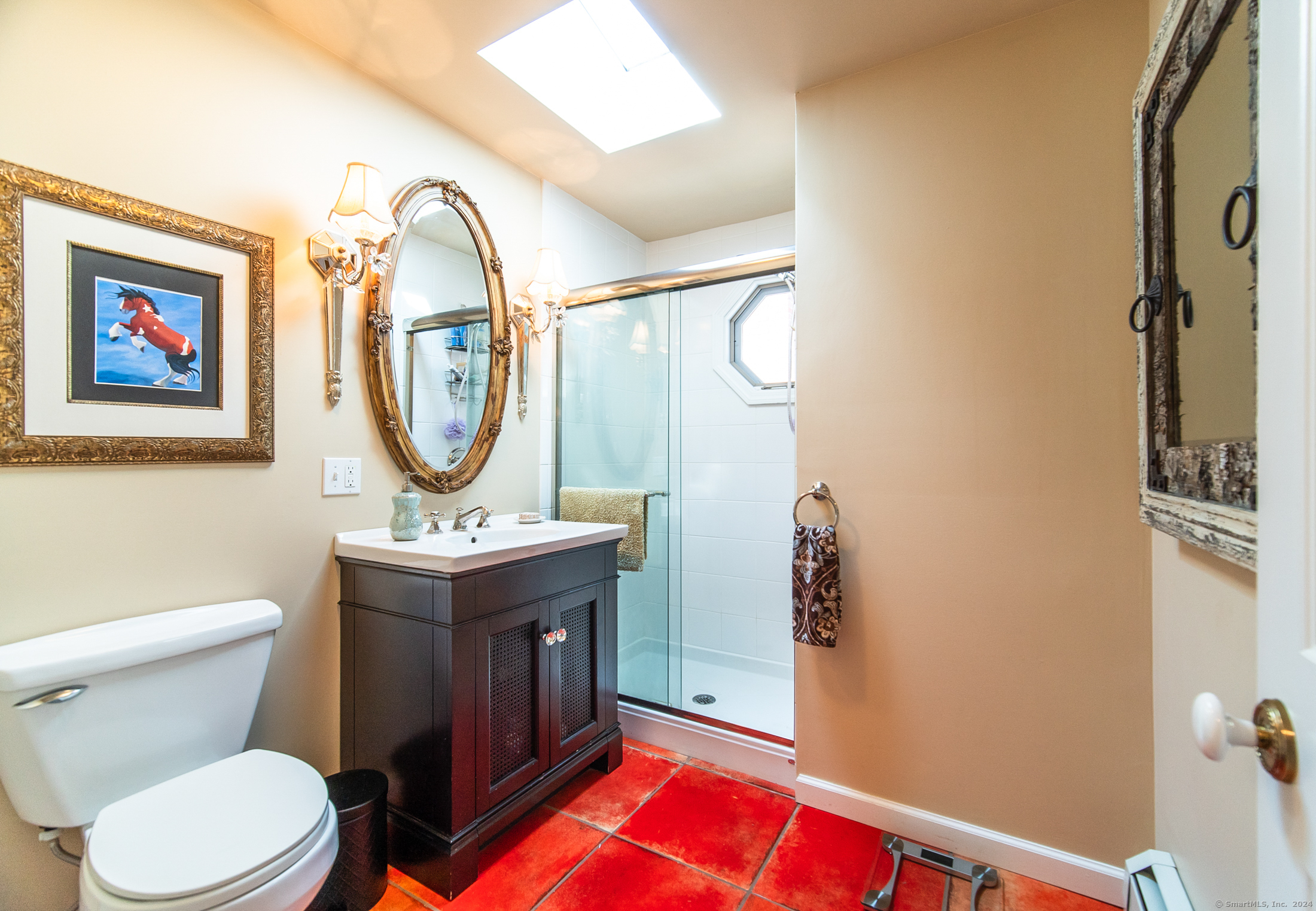 558 North Roast Meat Hill Road Killingworth, CT 06419 - Photo 12 of 37 a bathroom with a toilet a sink and a mirror