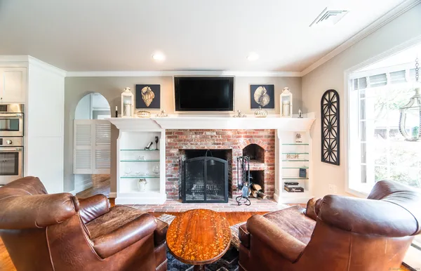 a living room with furniture and a fireplace