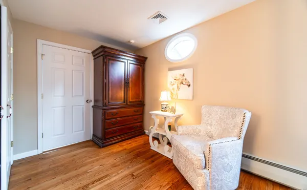 a view of a livingroom with furniture and wooden floor