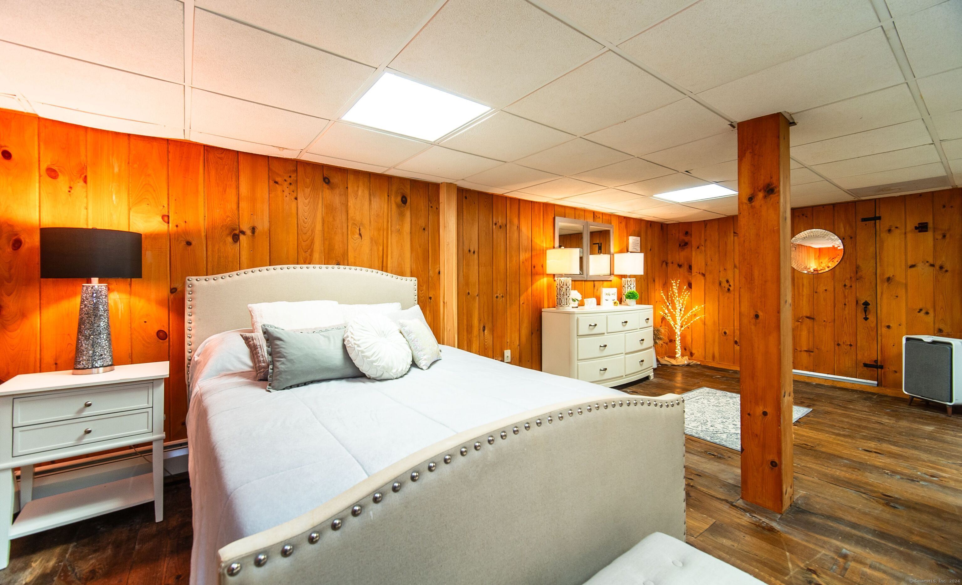 558 North Roast Meat Hill Road Killingworth, CT 06419 - Photo 20 of 37 a bedroom with a bed and wooden floor