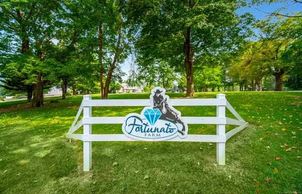 a view of a park with welcome board