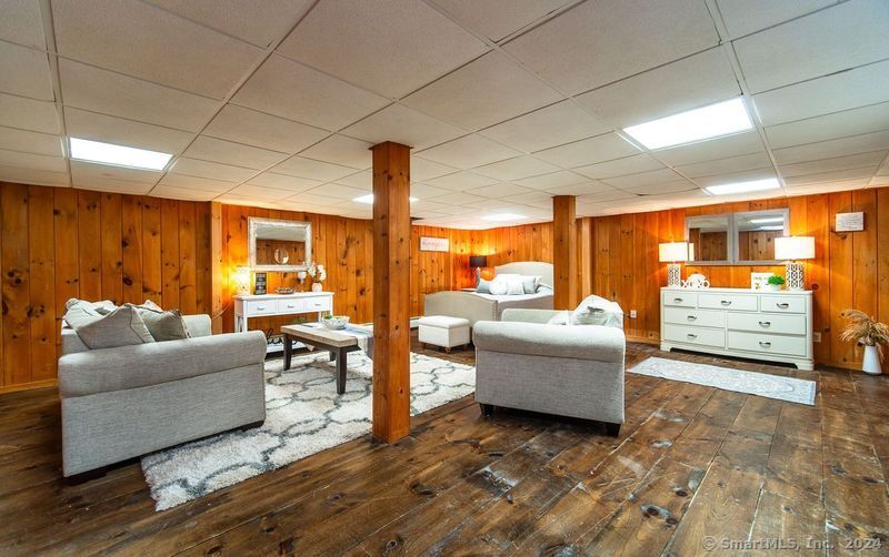 558 North Roast Meat Hill Road Killingworth, CT 06419 - Photo 22 of 37 a living room with furniture and a large window