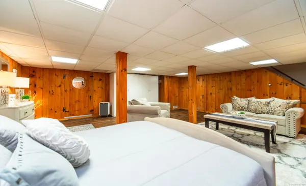 a spacious bedroom with a large bed and a couch