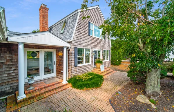 a front view of a house with garden