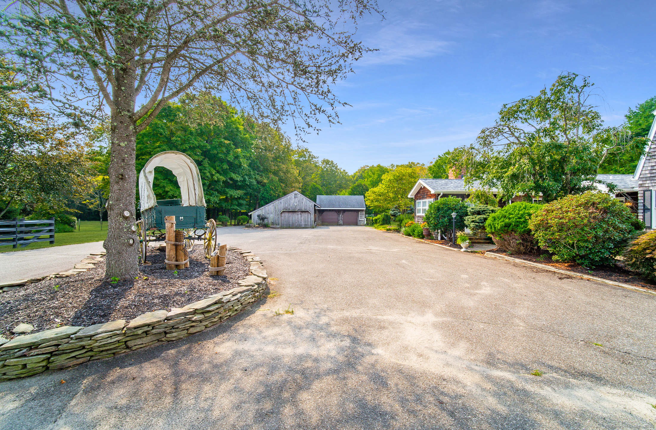558 North Roast Meat Hill Road Killingworth, CT 06419 - Photo 6 of 37 a view of a garden with a bench