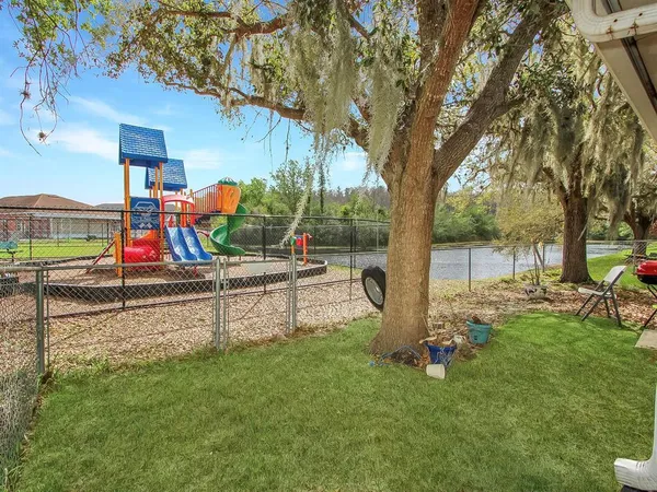 a view of park with swings and slides