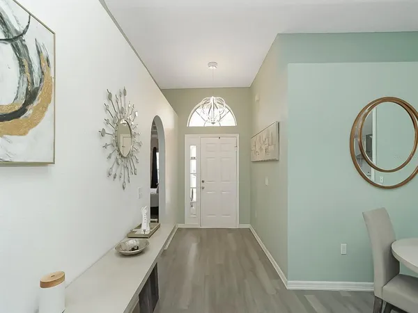 a view of a bathroom with a sink and a mirror
