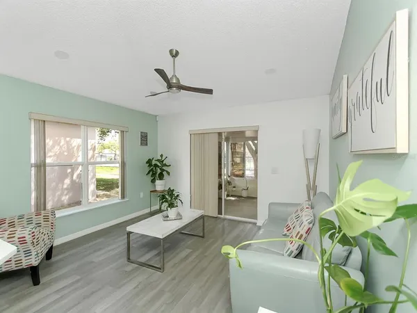 a living room with furniture and a window