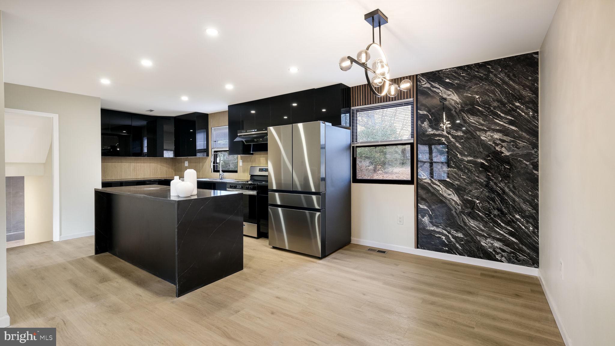 1617 Church Road Wyncote, PA 19095 - Photo 9 of 39 Sleek modern kitchen with bold accents.