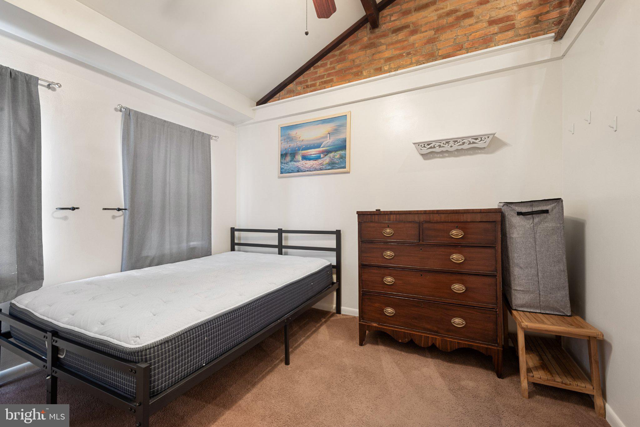 211 South Madeira Street Baltimore, MD 21231 - Photo 14 of 18 Charming bedroom with rustic accents.