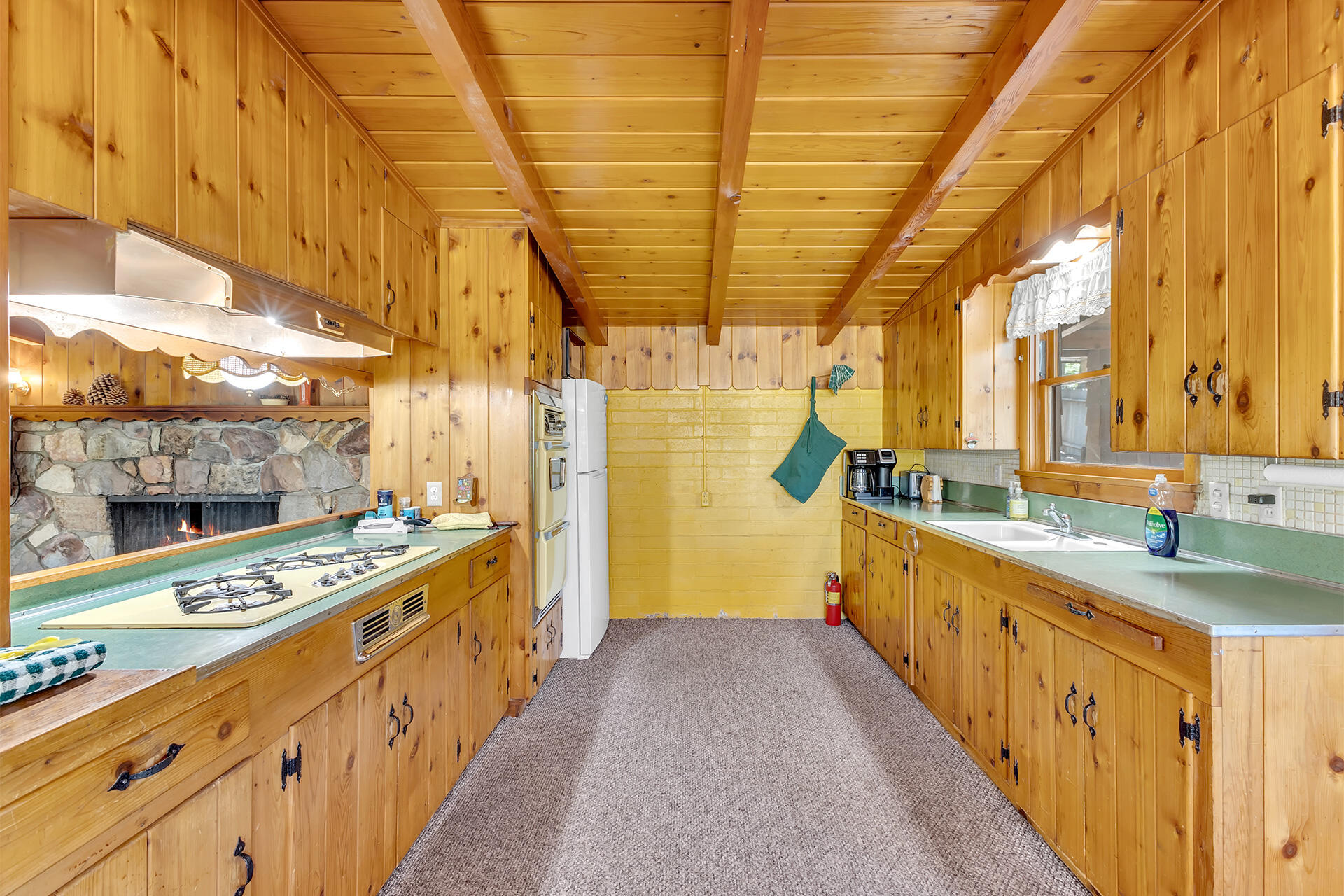25270 Palomar Road Idyllwild, CA 92549 - Photo 14 of 60 a view of a kitchen with a sink and wooden floor