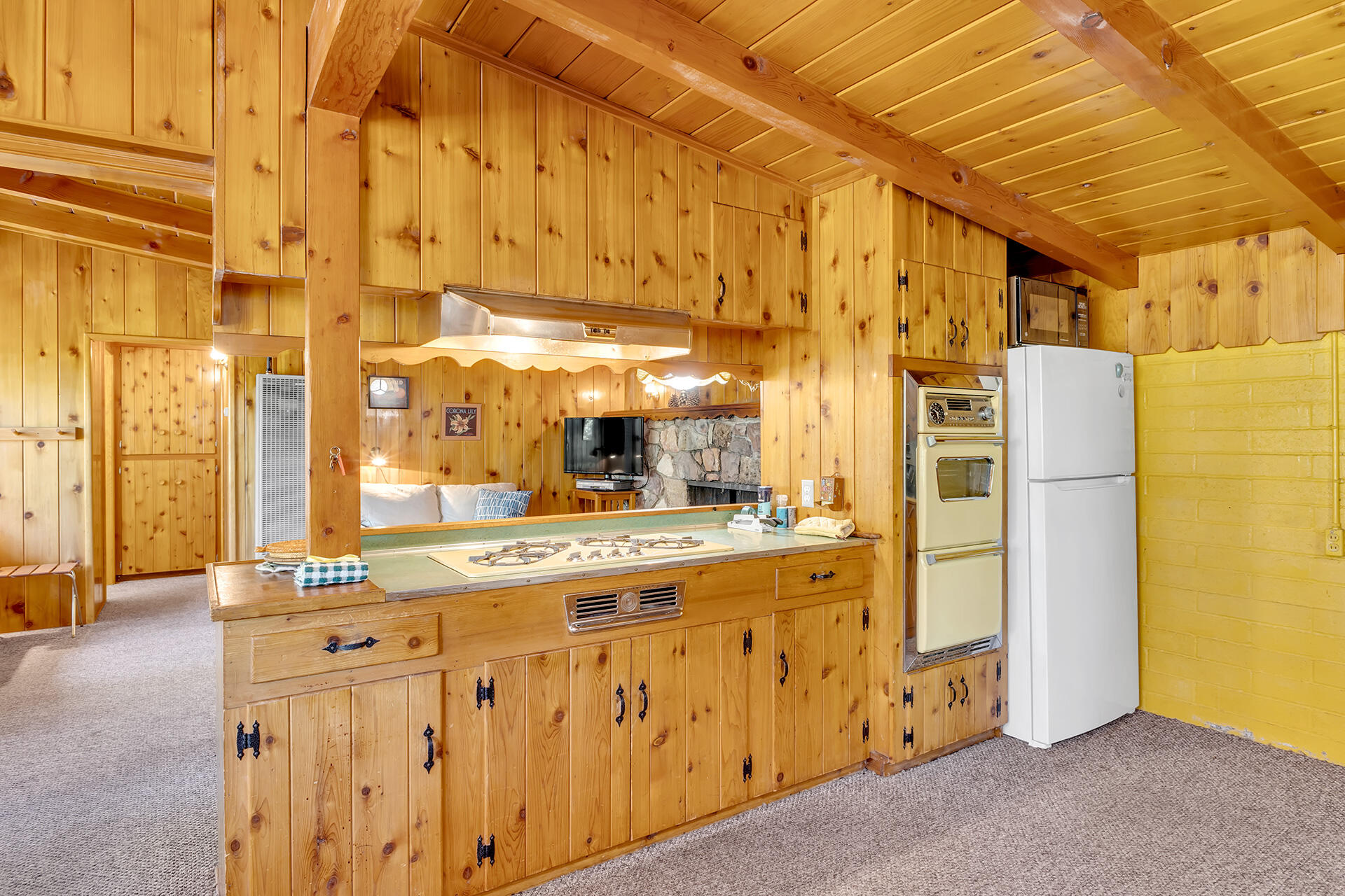 25270 Palomar Road Idyllwild, CA 92549 - Photo 17 of 60 a kitchen with cabinets and wooden floor