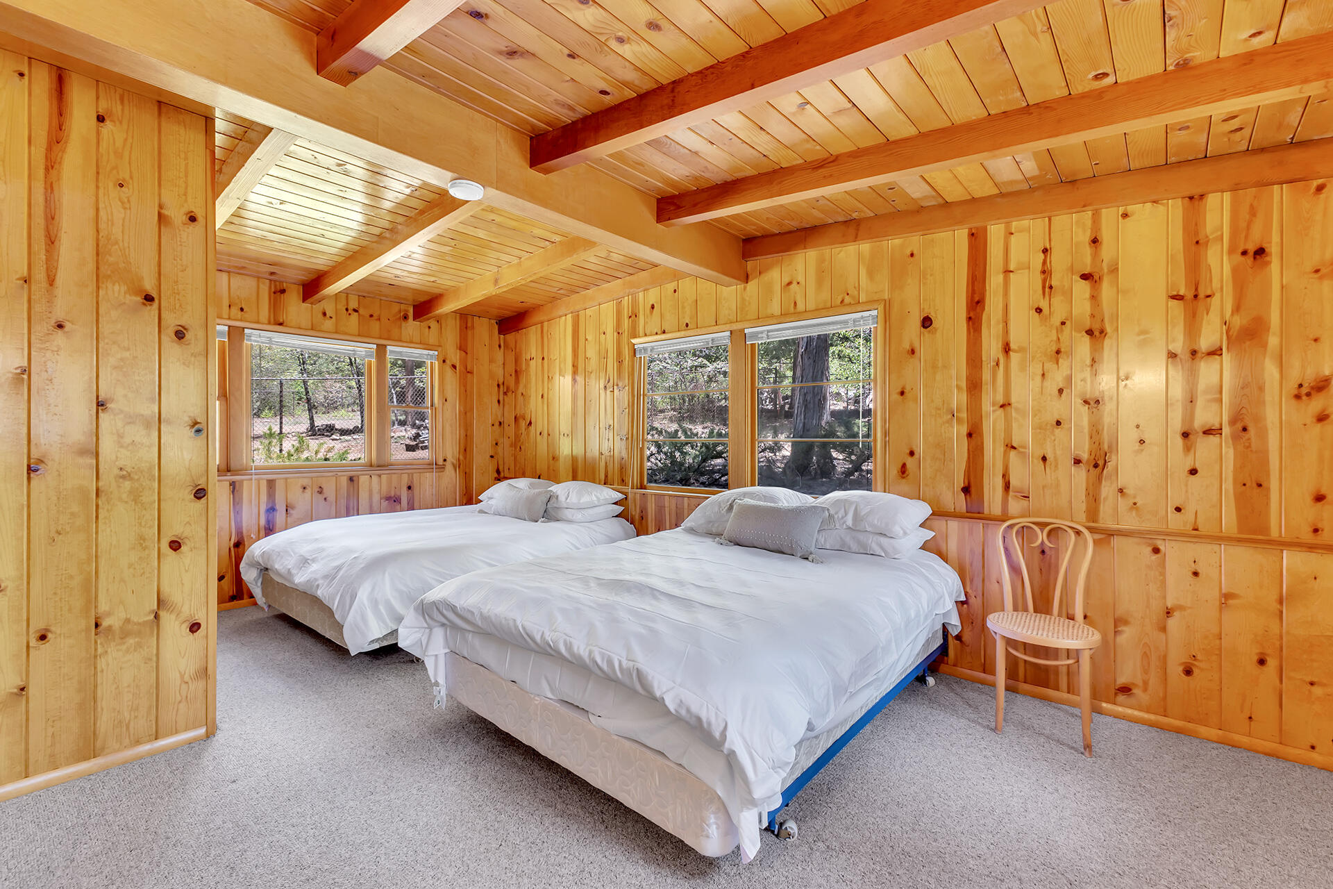 25270 Palomar Road Idyllwild, CA 92549 - Photo 29 of 60 a bedroom with a bed and a mirror