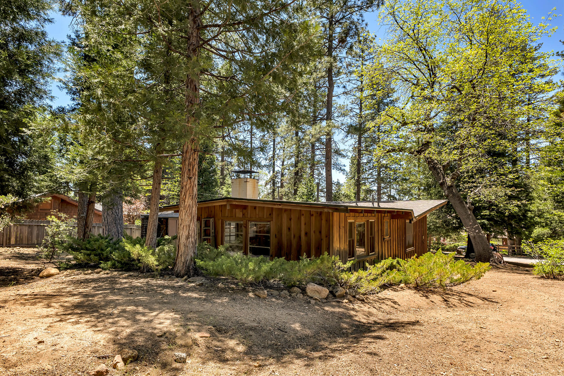 25270 Palomar Road Idyllwild, CA 92549 - Photo 46 of 60 a view of a house with large tree and wooden fence