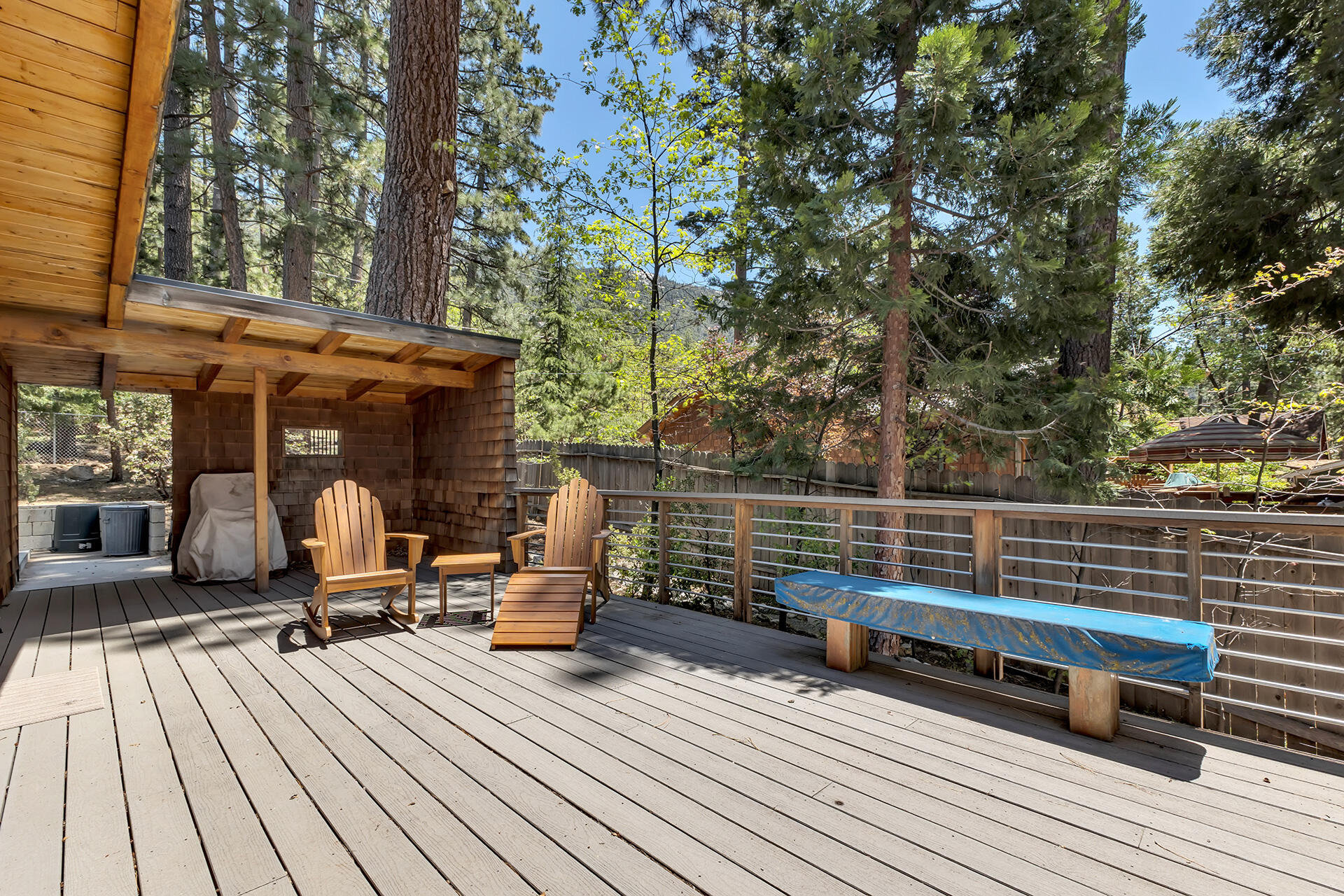 25270 Palomar Road Idyllwild, CA 92549 - Photo 51 of 60 a view of a roof deck with table and chairs wooden floor and fence