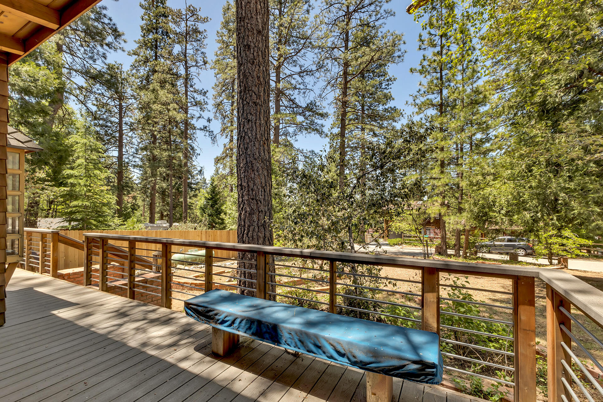 25270 Palomar Road Idyllwild, CA 92549 - Photo 53 of 60 a view of a balcony with wooden floor and fence