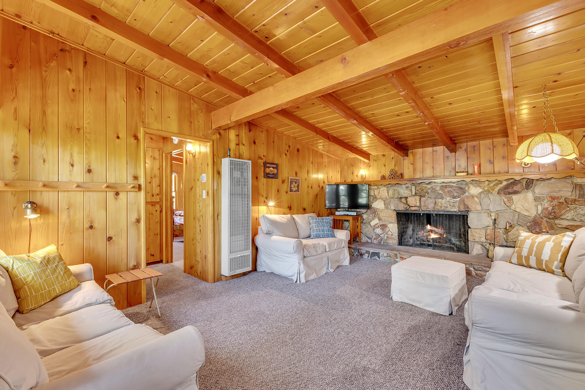 25270 Palomar Road Idyllwild, CA 92549 - Photo 8 of 60 a living room with furniture and a fireplace