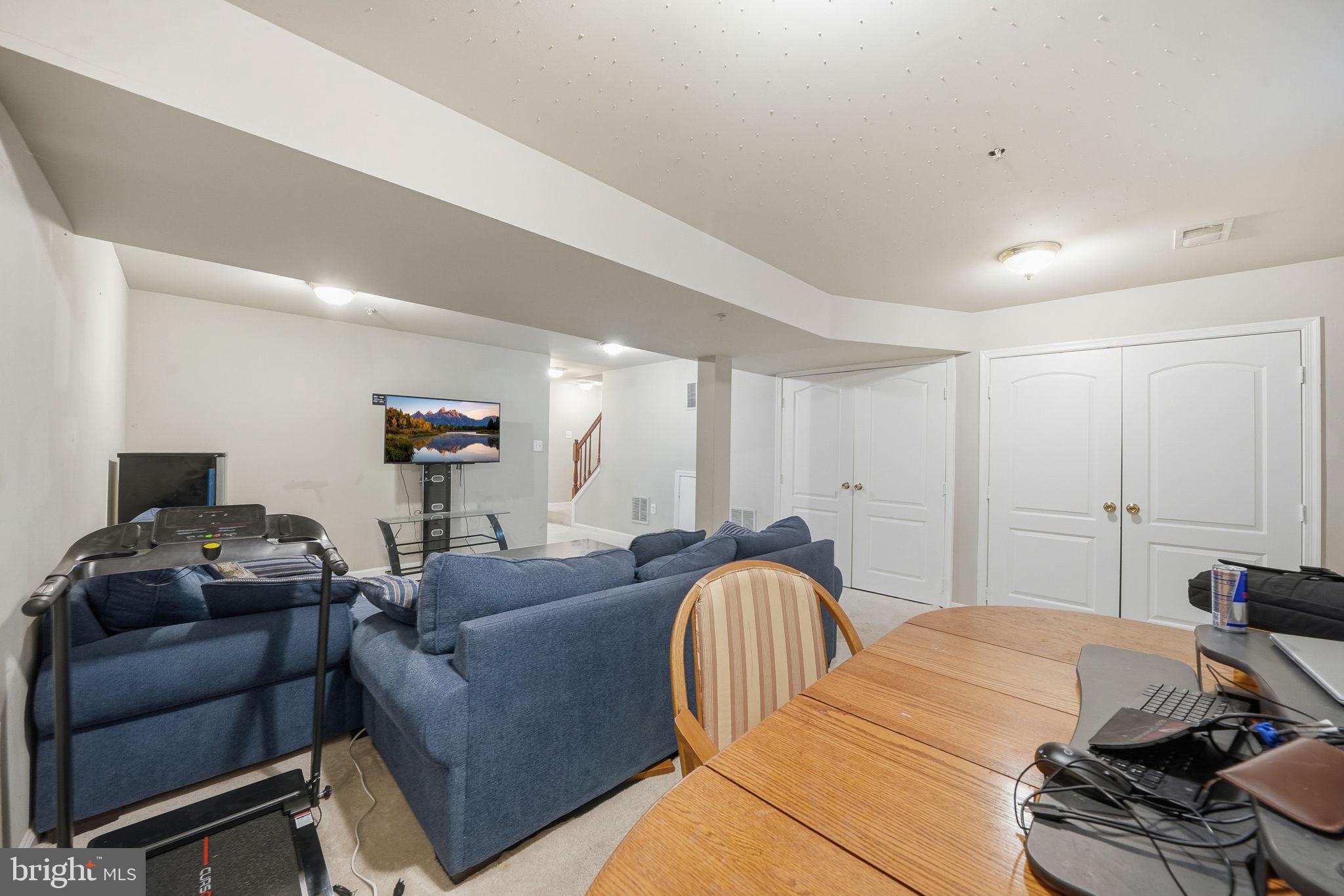 15420 Kennett Square Way Brandywine, MD 20613 - Photo 27 of 32 a bedroom with a bed and a couch