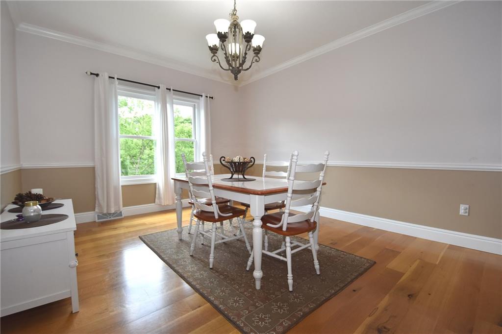 5050 East Willock Road Baldwin, PA 15236 - Photo 5 of 25 Large dining room with crown molding and chair rail
