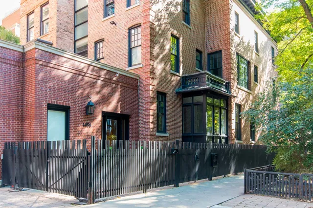 a front view of a building with glass windows