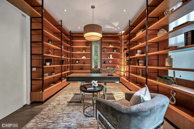a view of a livingroom with furniture and rug