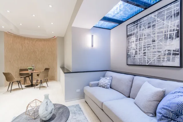 a living room with furniture and a table