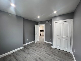 24 Judson Street, Unit 3 Boston, MA 02125 - Photo 13 of 18 wooden floor in an empty room with wooden floor