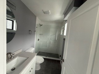 24 Judson Street, Unit 3 Boston, MA 02125 - Photo 17 of 18 a bathroom with a granite countertop sink toilet and shower