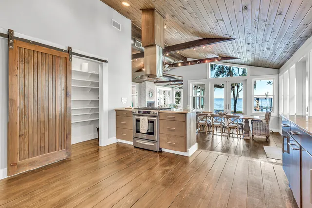 a view of a dining room with furniture wooden floor and window