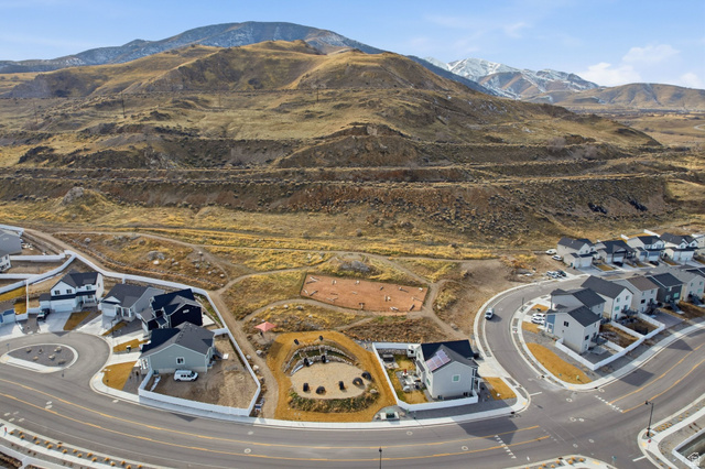 3808 Galatia Road Magna, UT 84044 - Photo 53 of 59 Aerial perspective highlighting a residential development with a mountain backdrop