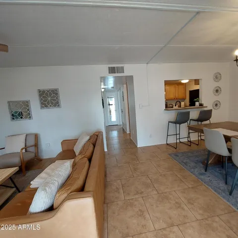 a very nice looking dining room with a table and chairs