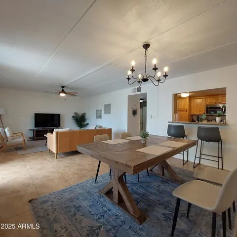 a kitchen with a sink a stove top oven and a refrigerator