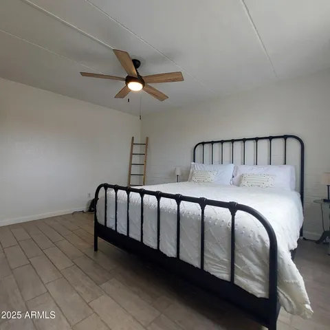 a bed room with a bed and a window