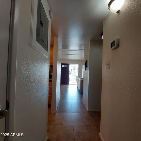 a view of lake with outdoor space and trees in the background
