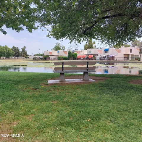 a front view of a building with palm trees