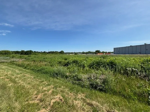a view of a lush green space with sea