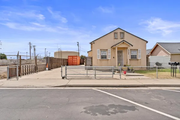 a view of a house with a street