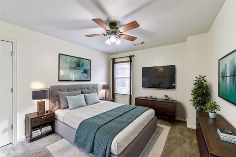 a bedroom with a bed and window