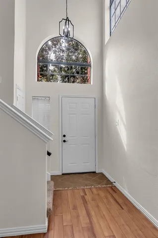 a view of an entryway with wooden floor