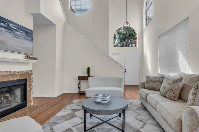 a living room with furniture and a fireplace