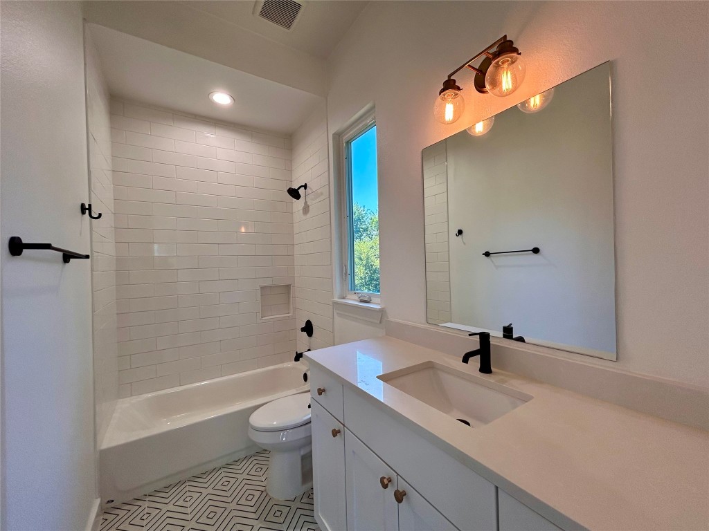 4010 Clawson Road, Unit 11 Austin, TX 78704 - Photo 13 of 19 a bathroom with a sink a toilet and shower