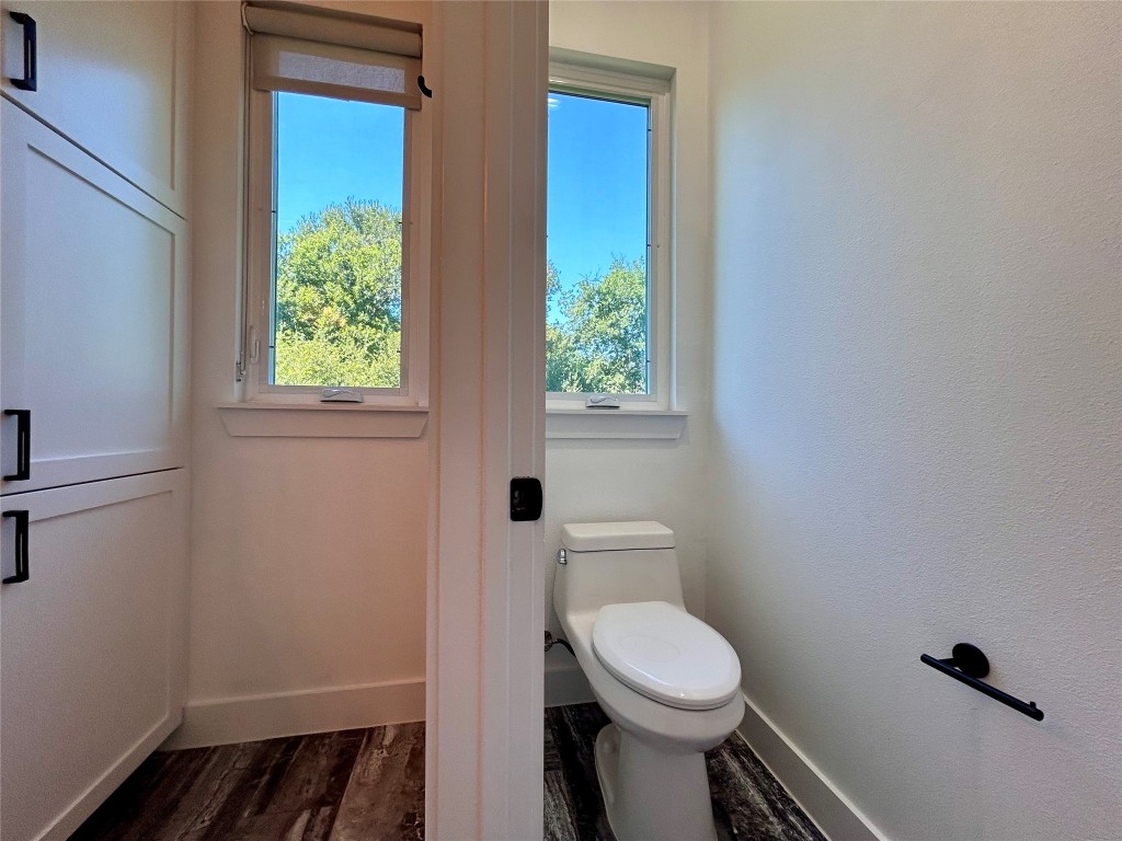 4010 Clawson Road, Unit 11 Austin, TX 78704 - Photo 17 of 19 a bathroom with a toilet a sink and a window