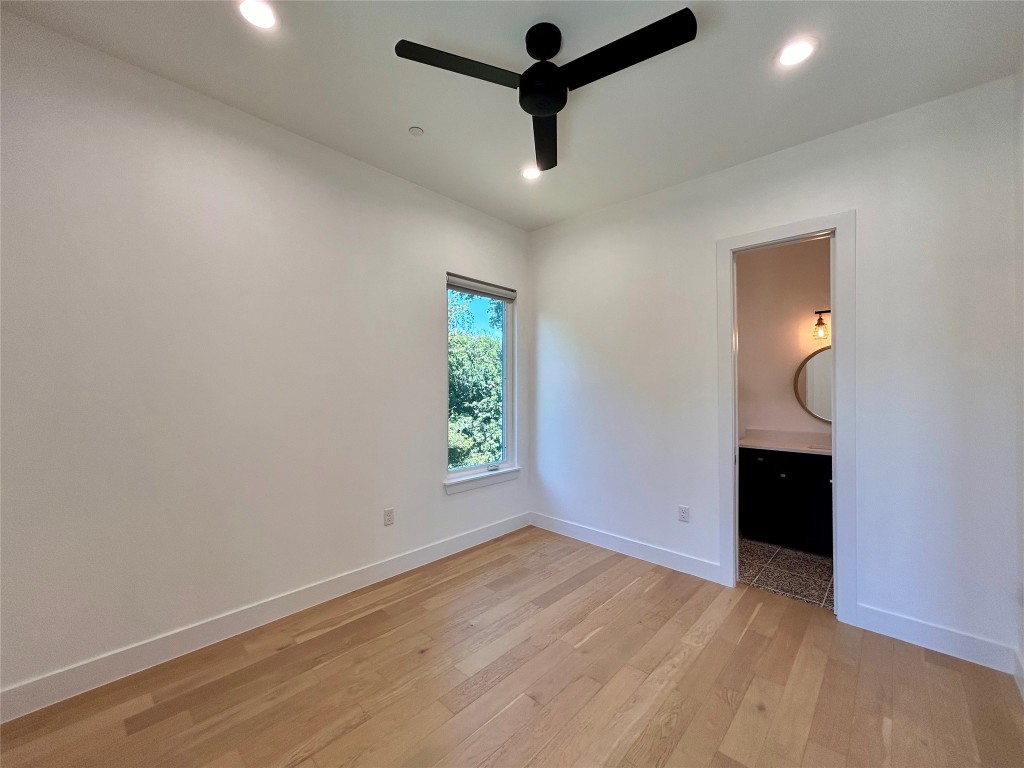 4010 Clawson Road, Unit 11 Austin, TX 78704 - Photo 2 of 19 an empty room with wooden floor cabinet and windows