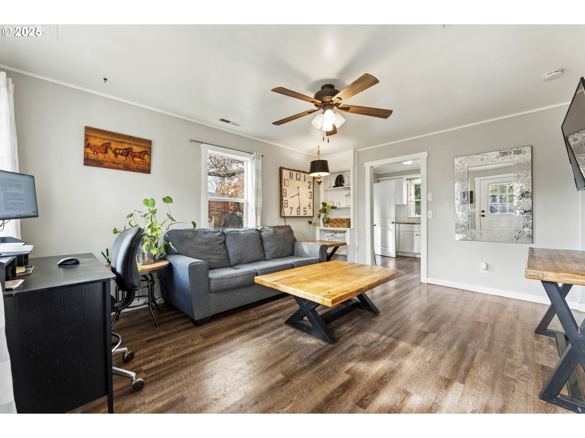 411 Lane Street Silverton, OR 97381 - Photo 2 of 21 a living room with furniture and a wooden floor