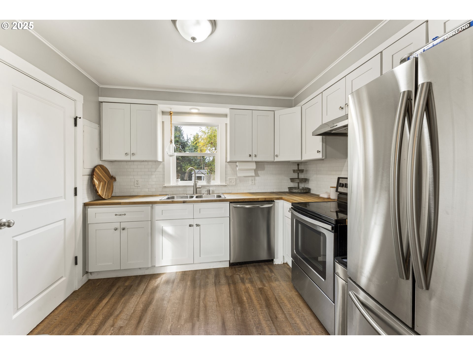 411 Lane Street Silverton, OR 97381 - Photo 3 of 21 a kitchen with stainless steel appliances granite countertop a refrigerator sink and stove