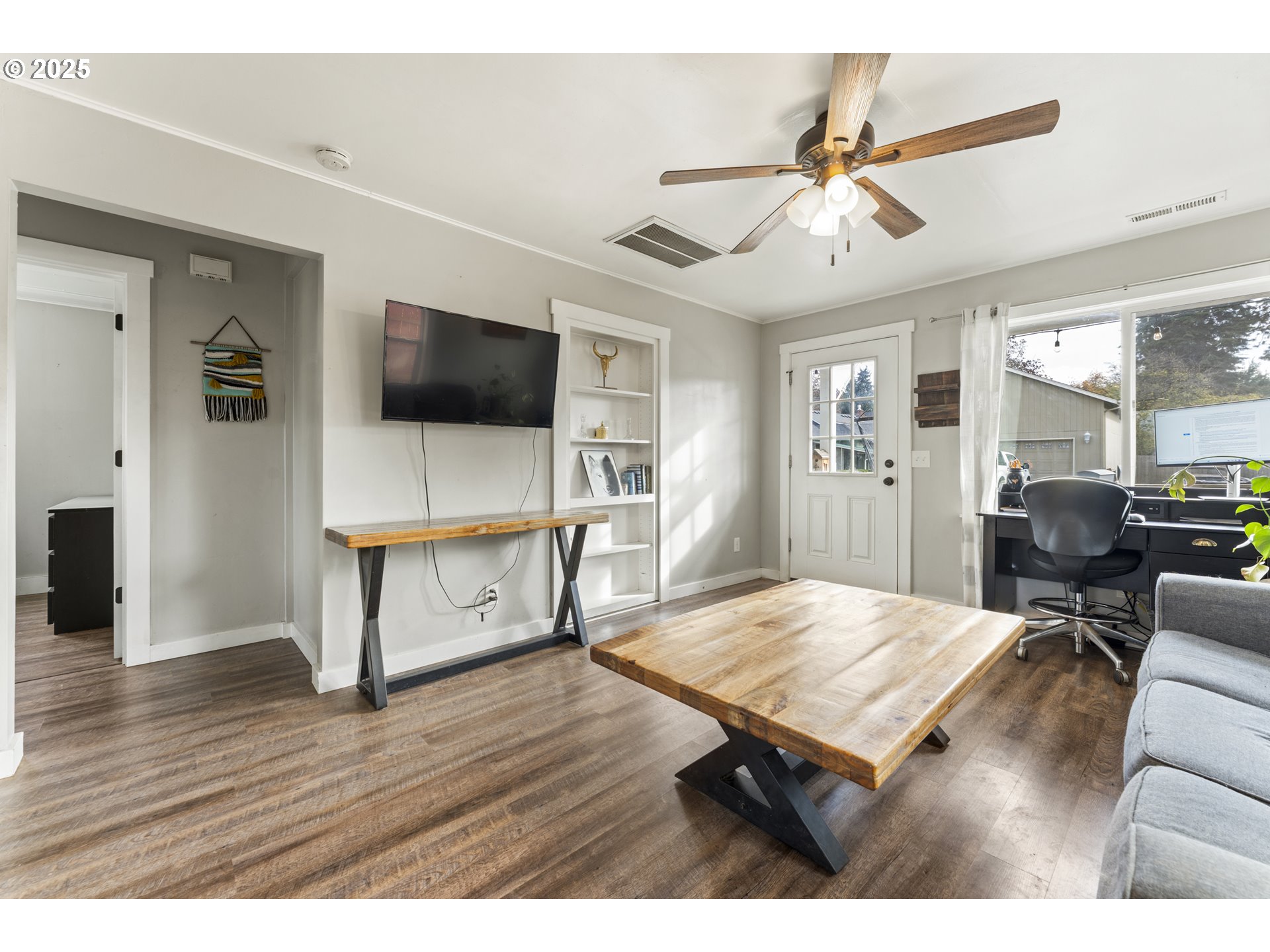 411 Lane Street Silverton, OR 97381 - Photo 5 of 21 a living room with furniture and a flat screen tv