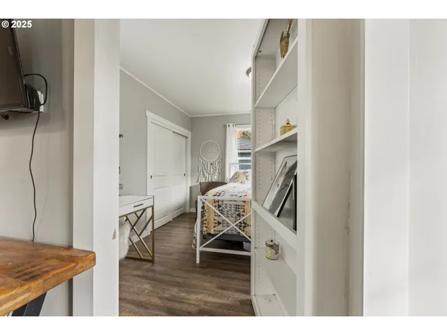 a view of a livingroom with furniture and a kitchen
