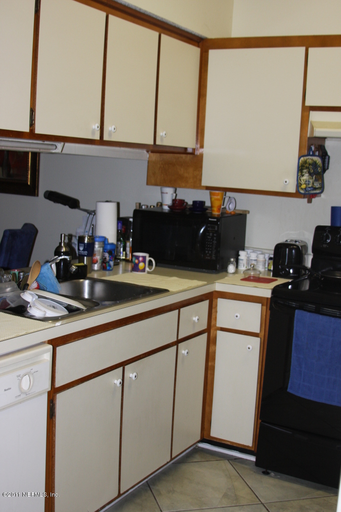 3417 Ricky Court Jacksonville, FL 32223 - Photo 5 of 16 a kitchen with a sink and cabinets