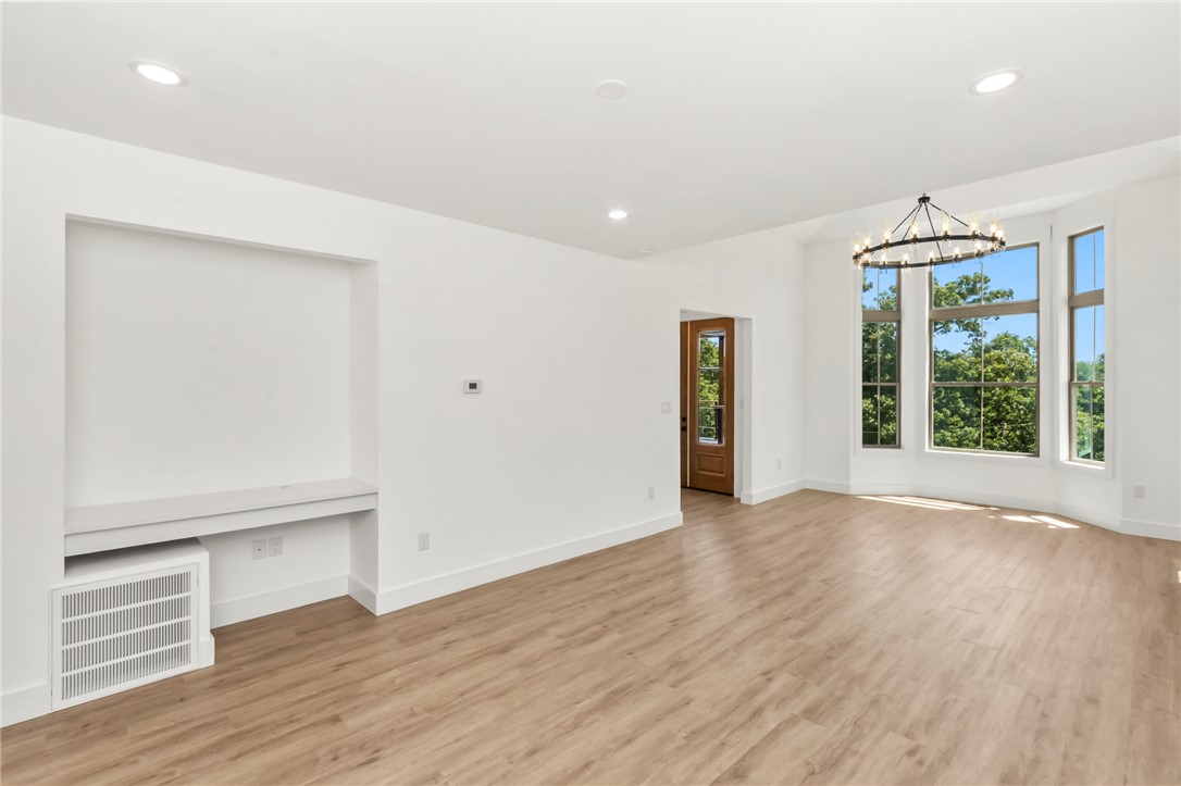 230 Hammond Circle Anderson, SC 29621 - Photo 26 of 48 This airy living space features abundant natural light and an elegant chandelier, perfect for gathering.