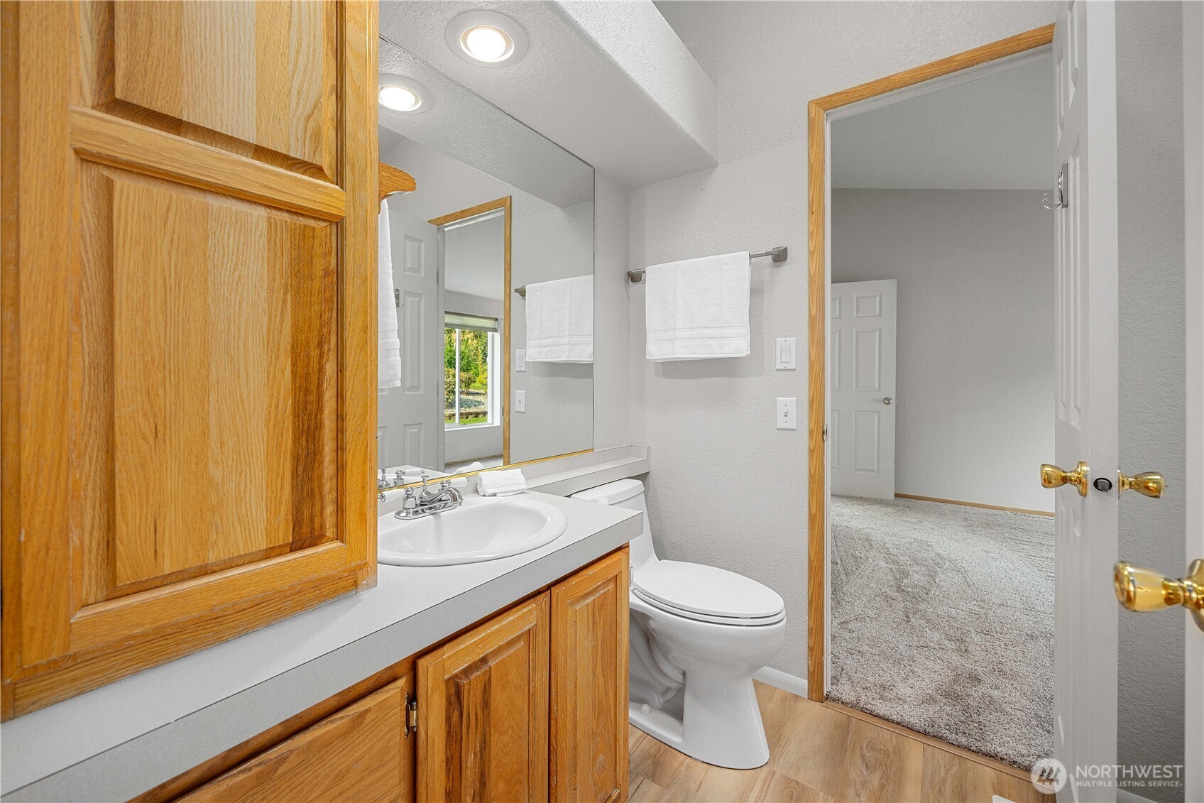 744 Wapato Lake Road Manson, WA 98831 - Photo 13 of 40 a bathroom with a granite countertop sink toilet and shower